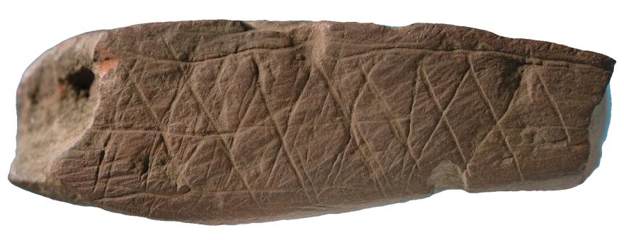 Fragment d'ocre gravé